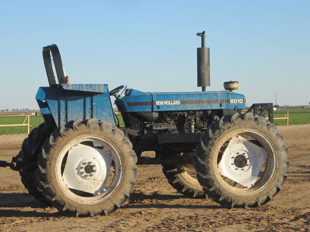 Blue tractor parked in a working field in Calexico, California