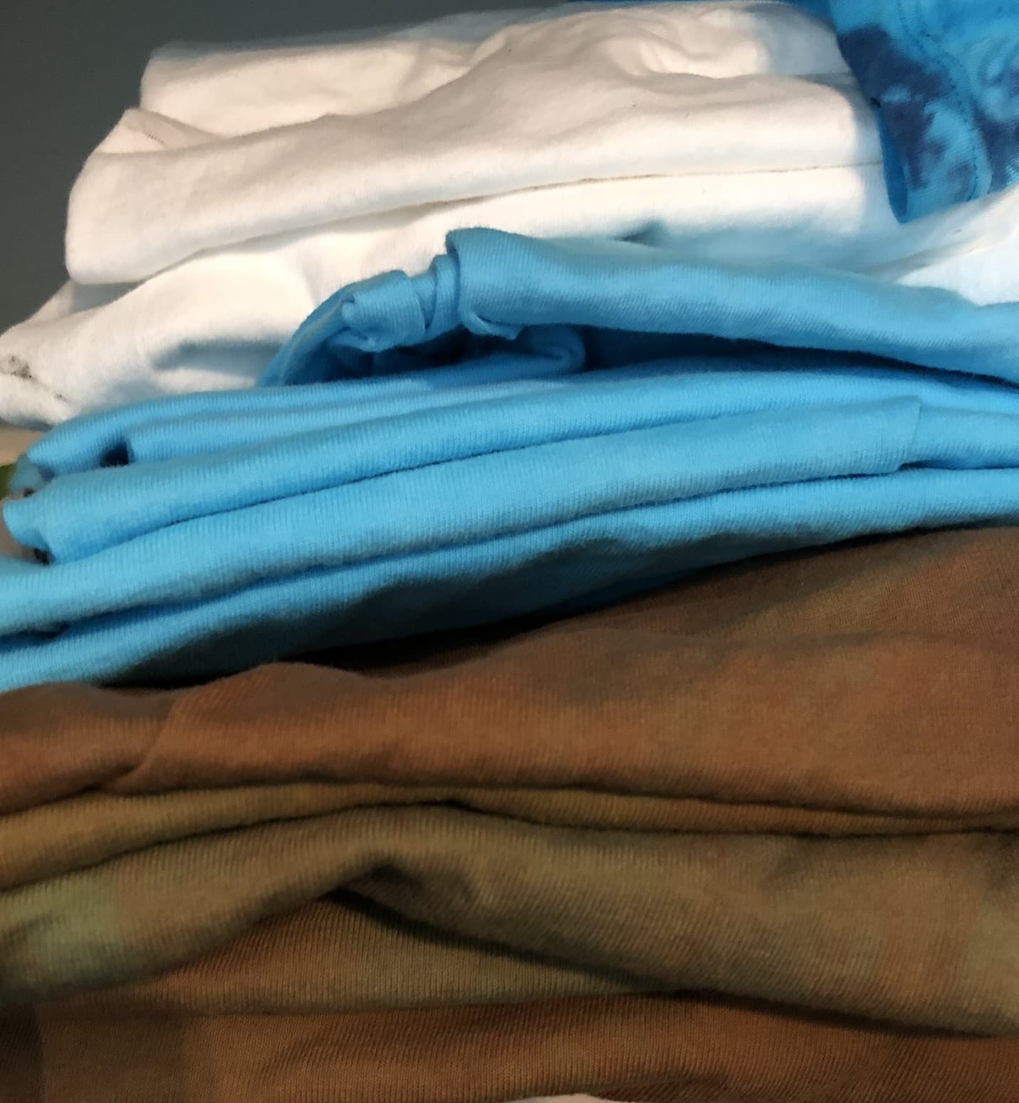 Hand dyed t-shirts from the early Sun & Rain Works Saturday Market days, the original handmade work behind the brand